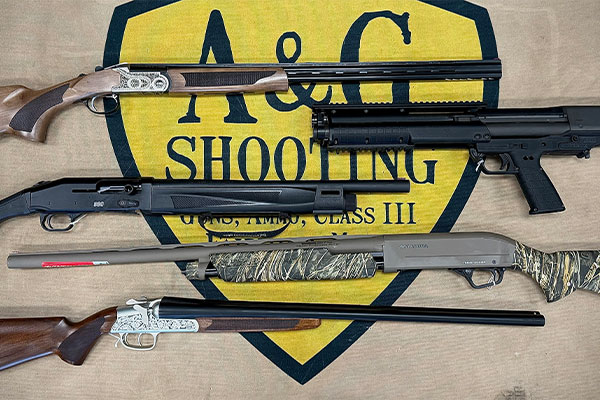 Five different shotguns and rifles displayed on a mat with the A&G Shooting logo and corresponding text.