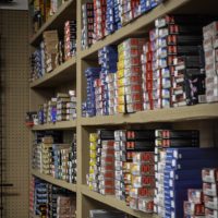 Shelves filled with various brands and boxes of ammunition organized by size and type.